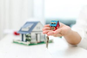 real-estate-agent-with-house-model-keys